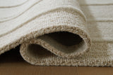 Rolled View of Teelgan Ivory Tan Rug