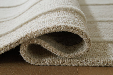 Rolled View of Teelgan Ivory Tan Rug