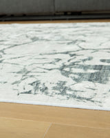 Rolled Tobinbury Gray Washable Area Rug side view