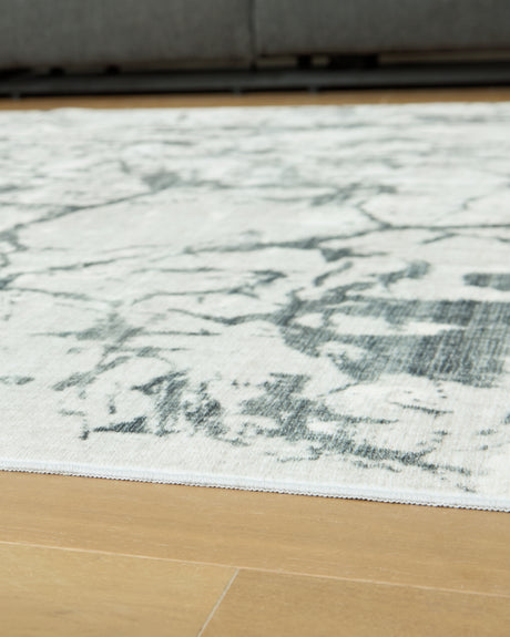 Rolled Tobinbury Gray Washable Area Rug side view