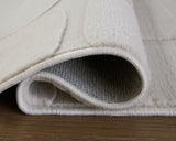 Rolled side view of Malvinsboro Sandstone Washable rug