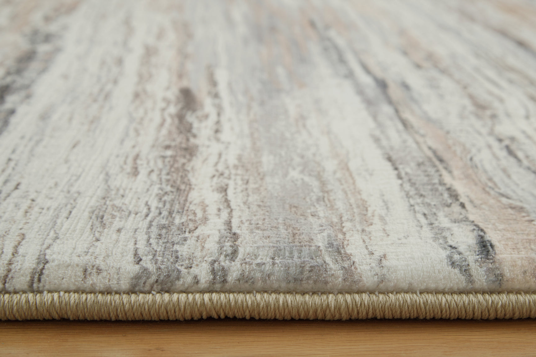 Rolled edge detail of Nace memory foam area rug