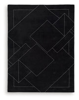 Close up of black and white geometric wool rug texture