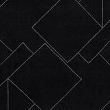 Swatch showing Marav rug's black and white colors and fiber