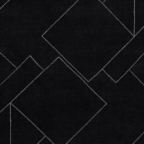Swatch showing Marav rug's black and white colors and fiber