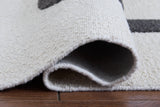 Hand tufted abstract pattern in ivory taupe charcoal colors