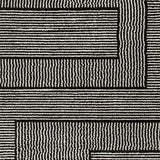 Swatch showing black and ivory colors of Kurtmen rug