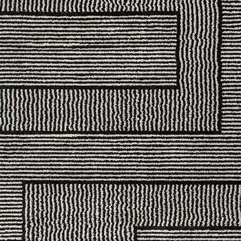 Swatch showing black and ivory colors of Kurtmen rug