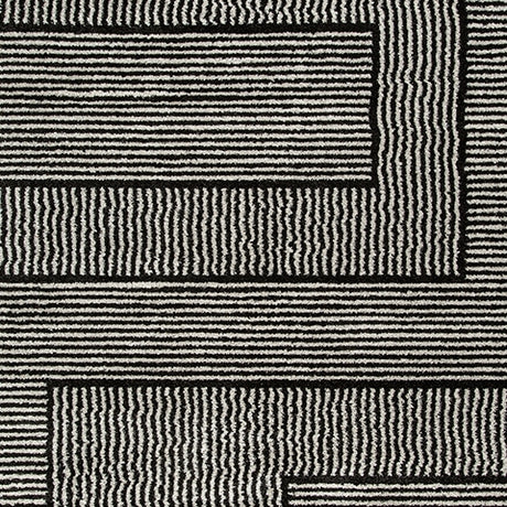 Swatch showing black and ivory colors of Kurtmen rug
