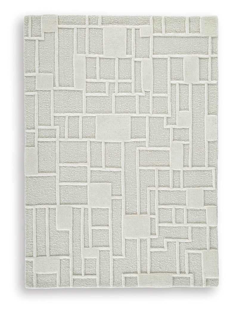 Rolled Empriss Ivory 5x7 area rug showing edge details