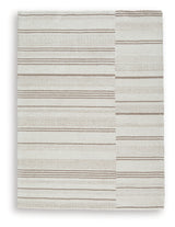 Close-up detail of Gadence ivory and tan area rug pattern