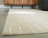 Close-up detail of hand-tufted wool fibers on Tan/Ivory rug