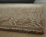 Rolled Merrittman area rug showing pile texture