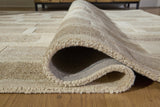 Rolled Lisgrove rug showing hand-tufted weave