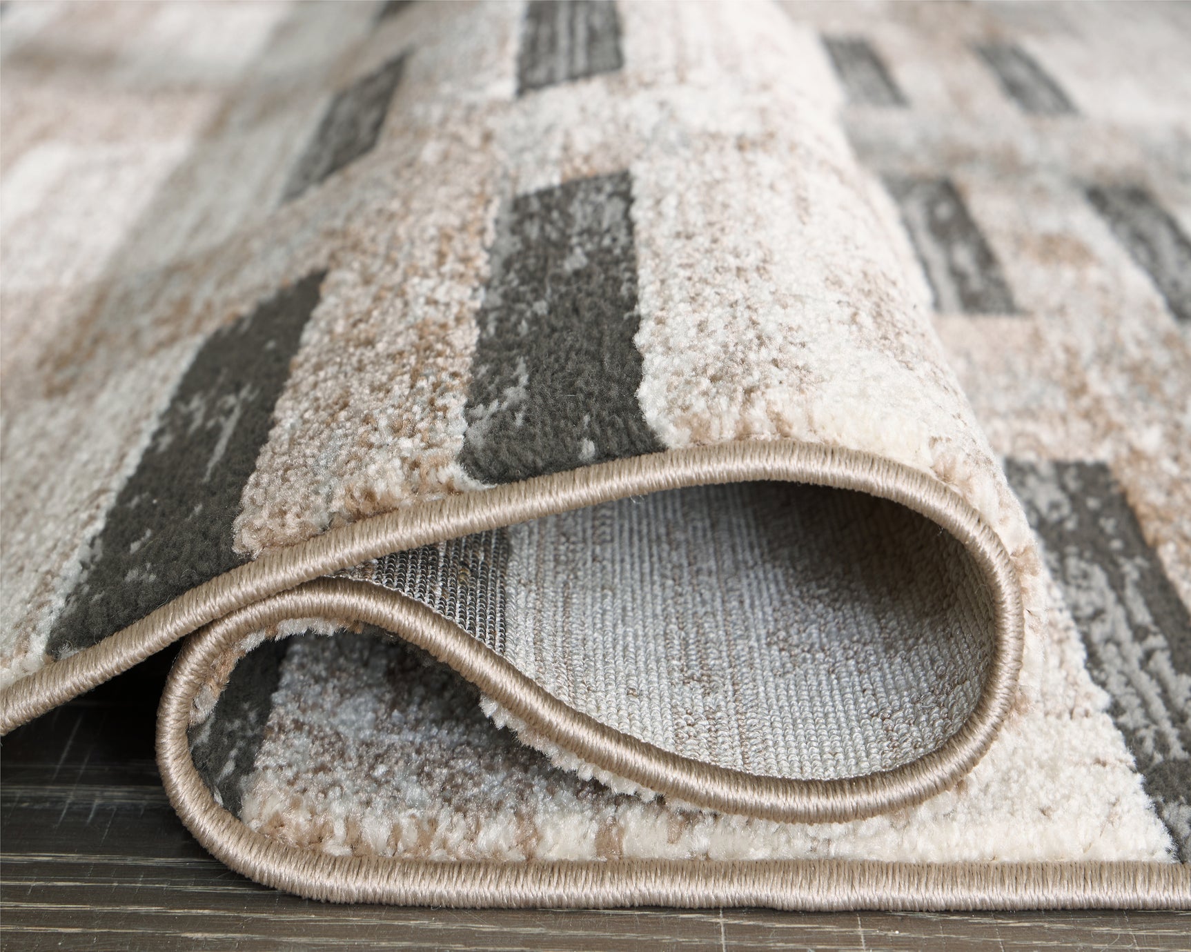 Rolled view of Alstone rug showing striped pattern