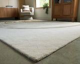 Close-up of abstract ripple pattern on Rizwana area rug