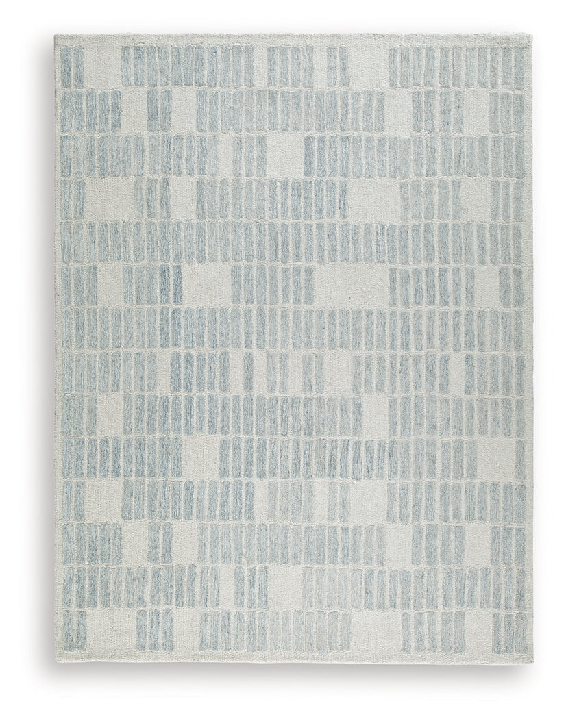 Hand-tufted geometric pattern detail of Dylanton ivory and blue rug