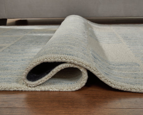 Rolled edge detail of the Dylanton ivory and blue rug