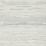 Genemost rug color swatch showing ivory and blue fibers