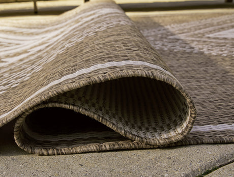 Rolled Dunsler rug showing thickness and backing