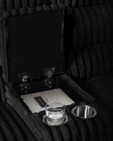 Close-up of sectional storage console with cupholders