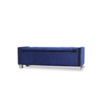 Bench in a styled room setting with blue velvet upholstery and tufted seat