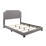 Close-up of grey fabric upholstery and solid wood frame on Miranda bed