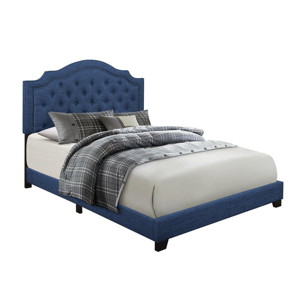 Close-up of tufted headboard in blue fabric