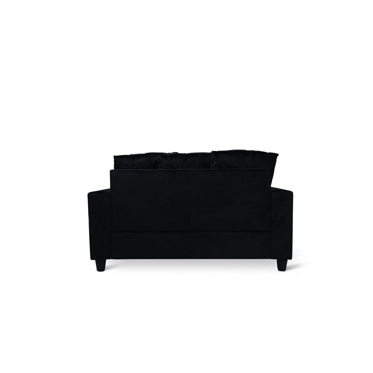 Black velvet loveseat with two pillows, back view