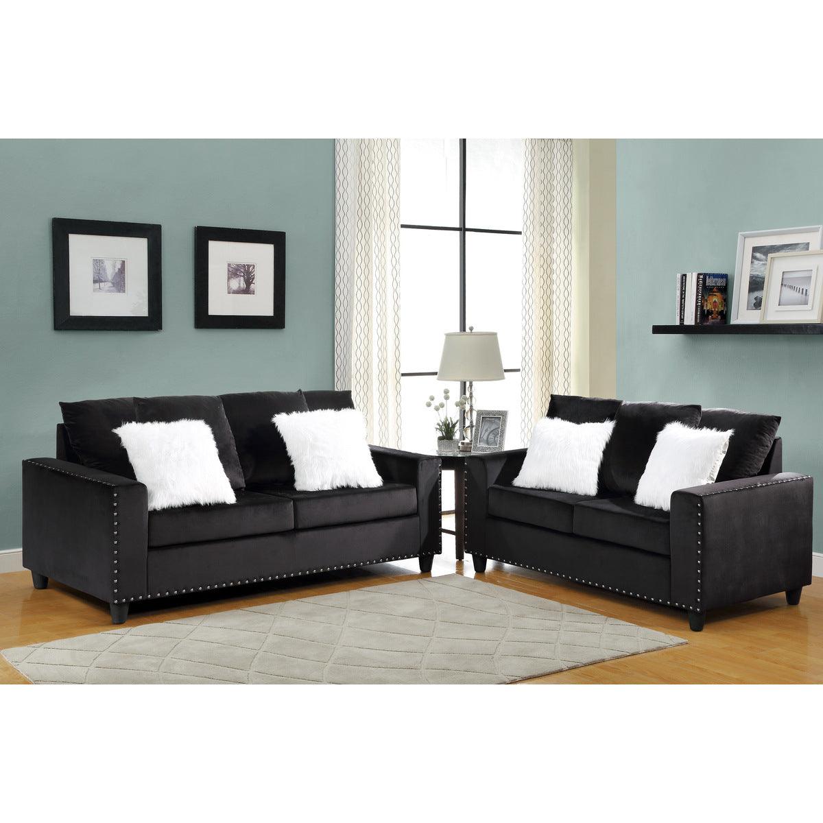 Black velvet loveseat with two pillows