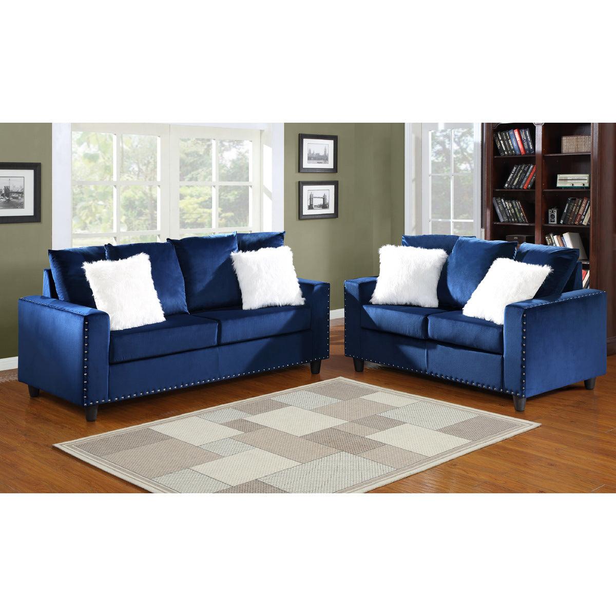 Blue velvet loveseat angled view with pillows