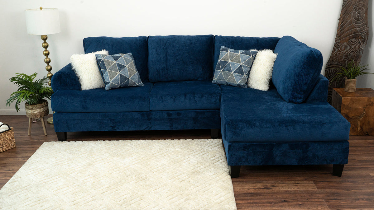 Side angle of Selena Navy 124" Sectional showcasing plush upholstery