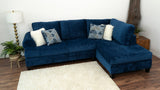 Room view of Selena Navy 124" Sectional sofa with pillows