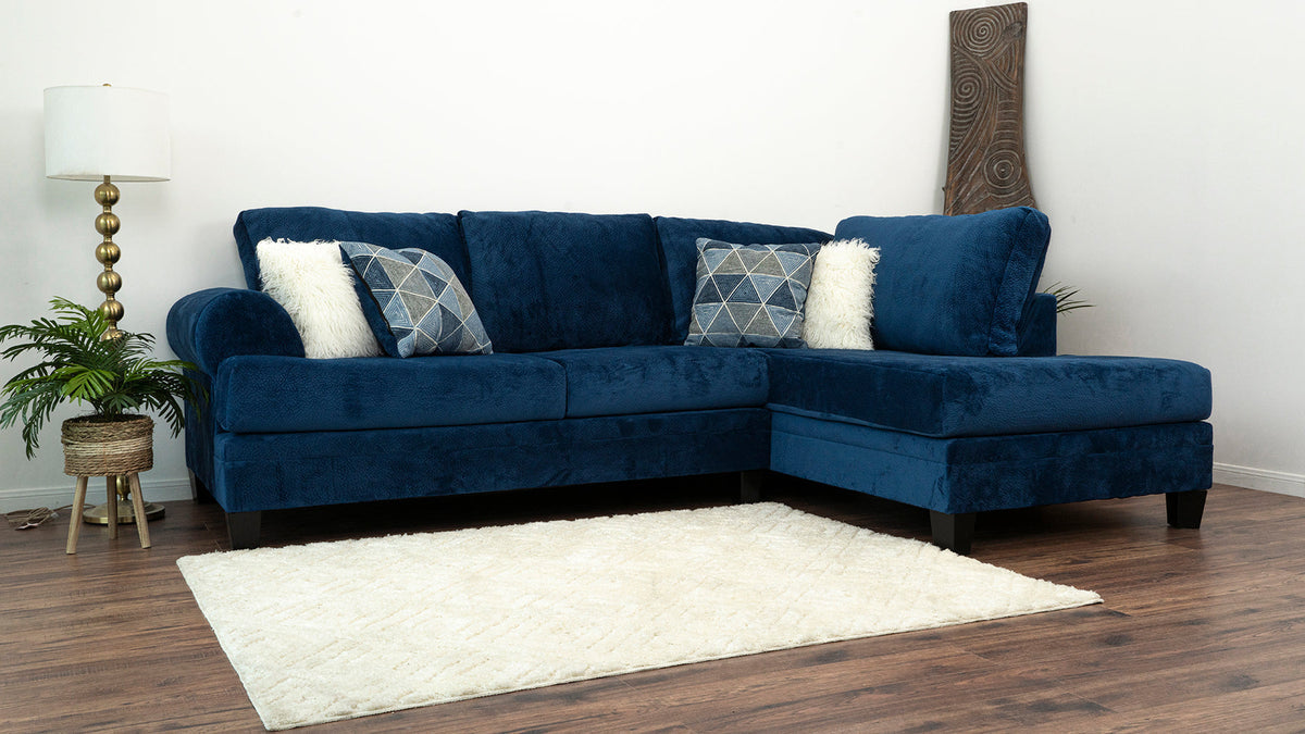 Front view of Selena Navy 124" Sectional sofa in living room setting
