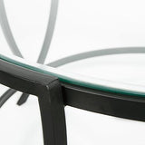 Close-up of glass tabletop and black metal finish on Tarrin Table