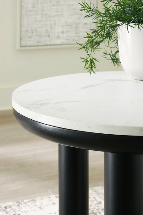Close-up of end table’s marble-like surface and base