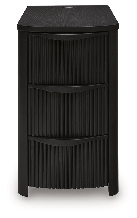 Front view showing three drawers closed