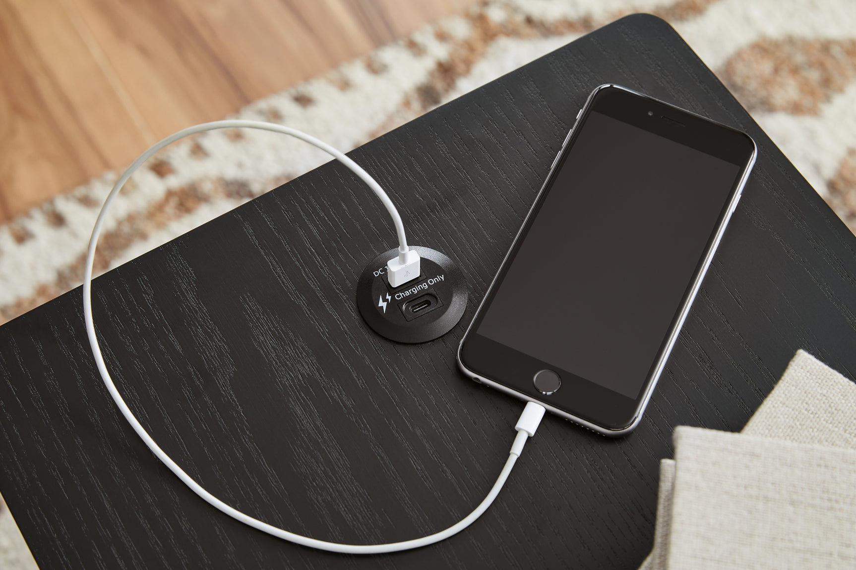 Close-up of USB charging ports on end table