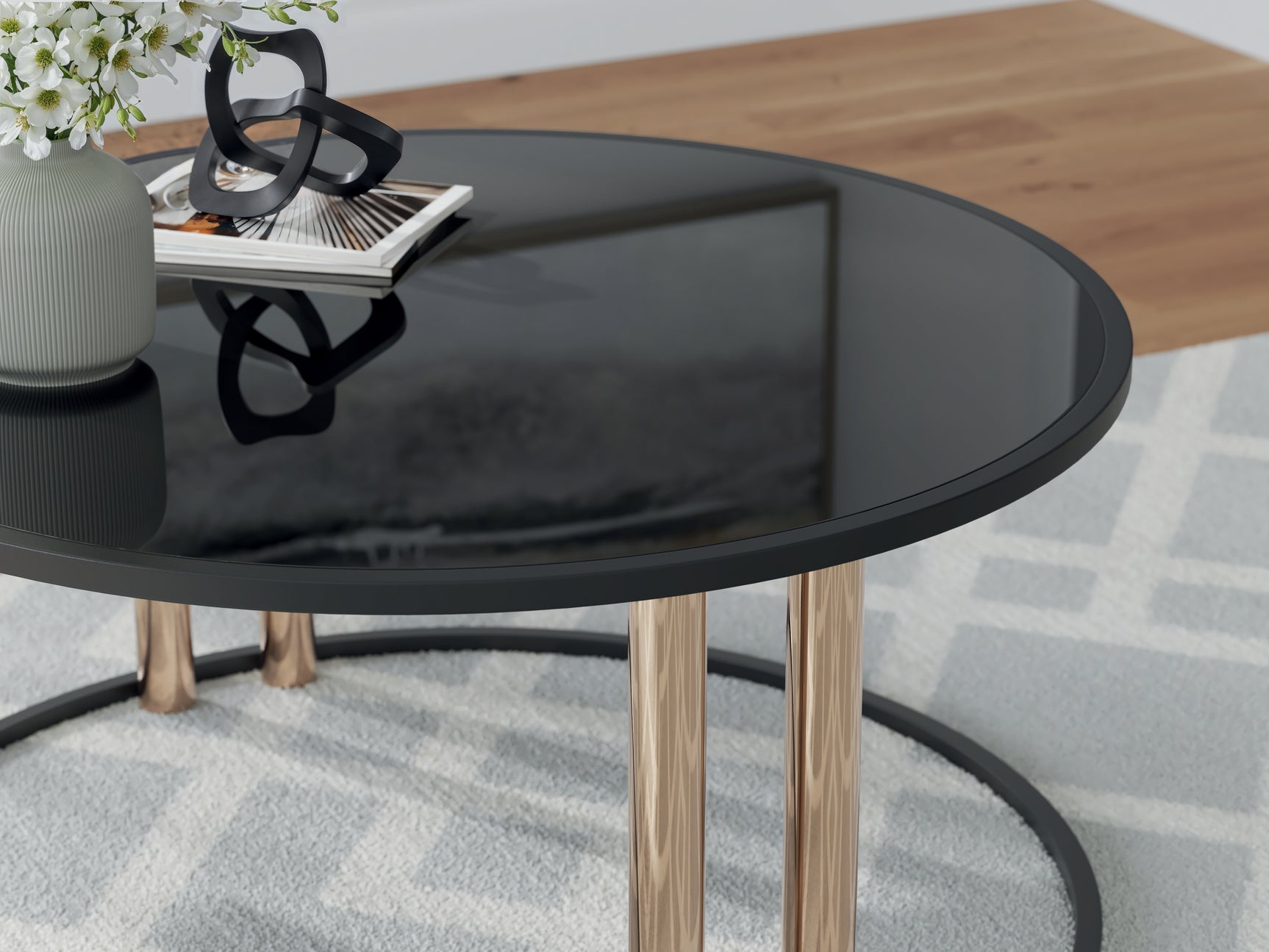 Close-up of Hannerly coffee table black glass top and gold-tone legs