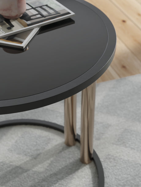 Detail of Hannerly end table with black glass top and metal legs