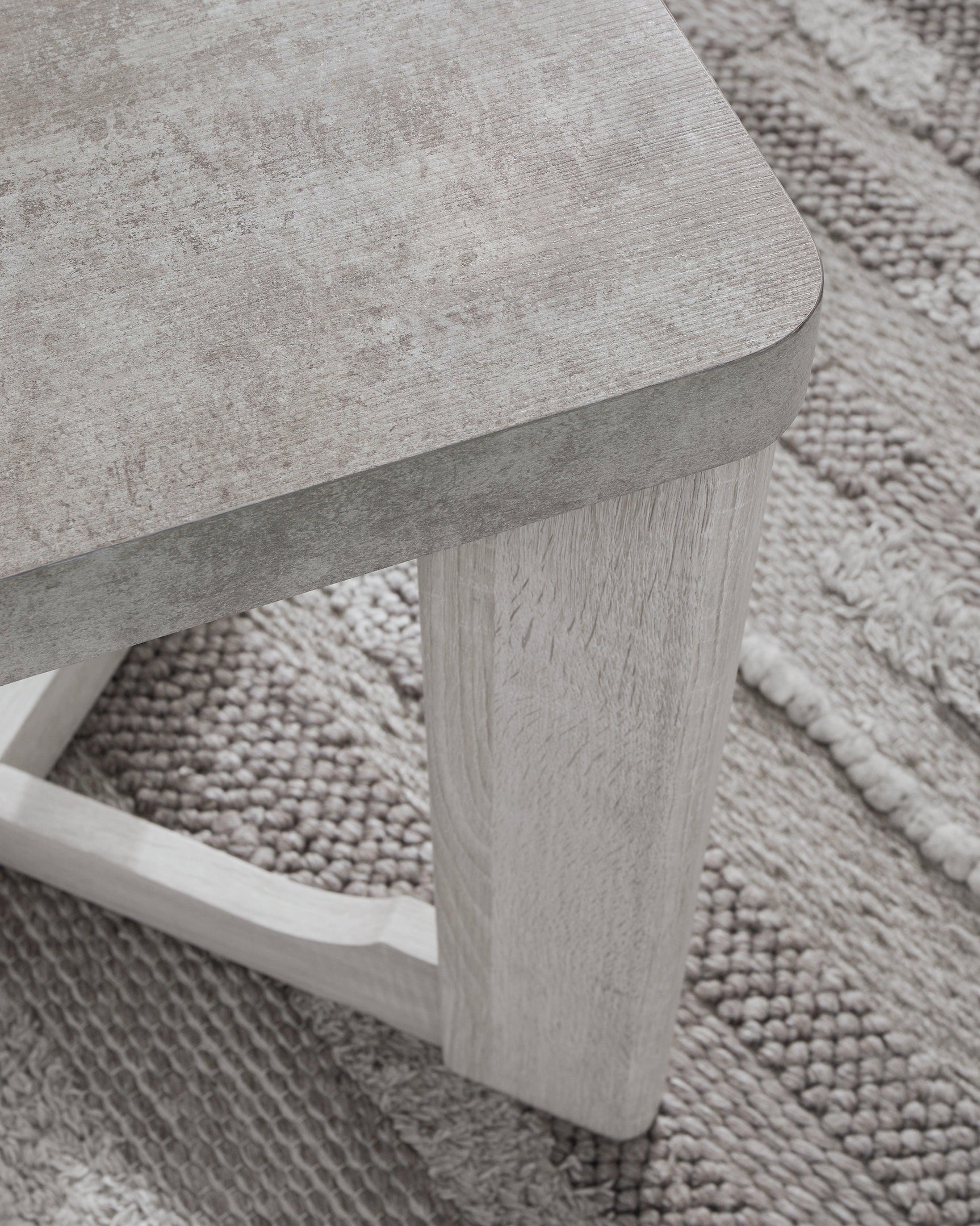 Garnilly Whitewash End Table - close detail of leg and finish