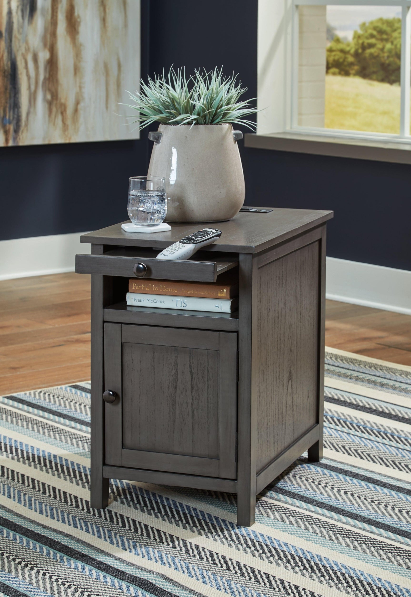 Open storage cabinet of Treytown Gray Chairside End Table