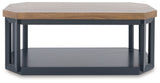 Detail of wood-tone tabletop and slate blue base on Landocken coffee table