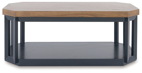 Detail of wood-tone tabletop and slate blue base on Landocken coffee table