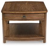 Lower shelf of Burkbyer Coffee Table with decorative items