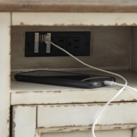 Built-in USB charging ports and electrical outlets on Realyn end table