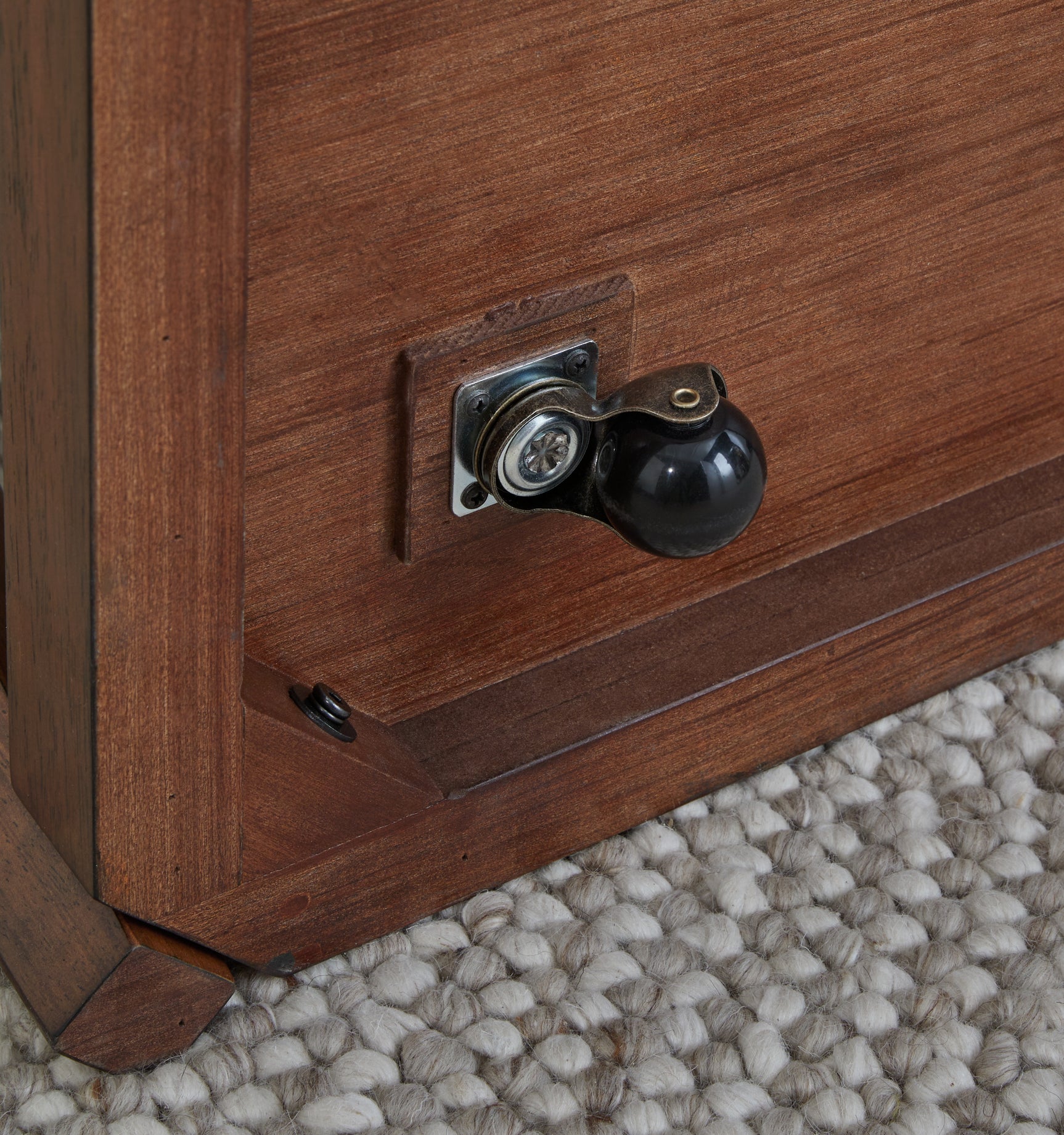 Close-up of caster wheel on Trenmour coffee table