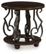 Frallyn dark brown round end table angled side view showing metal legs
