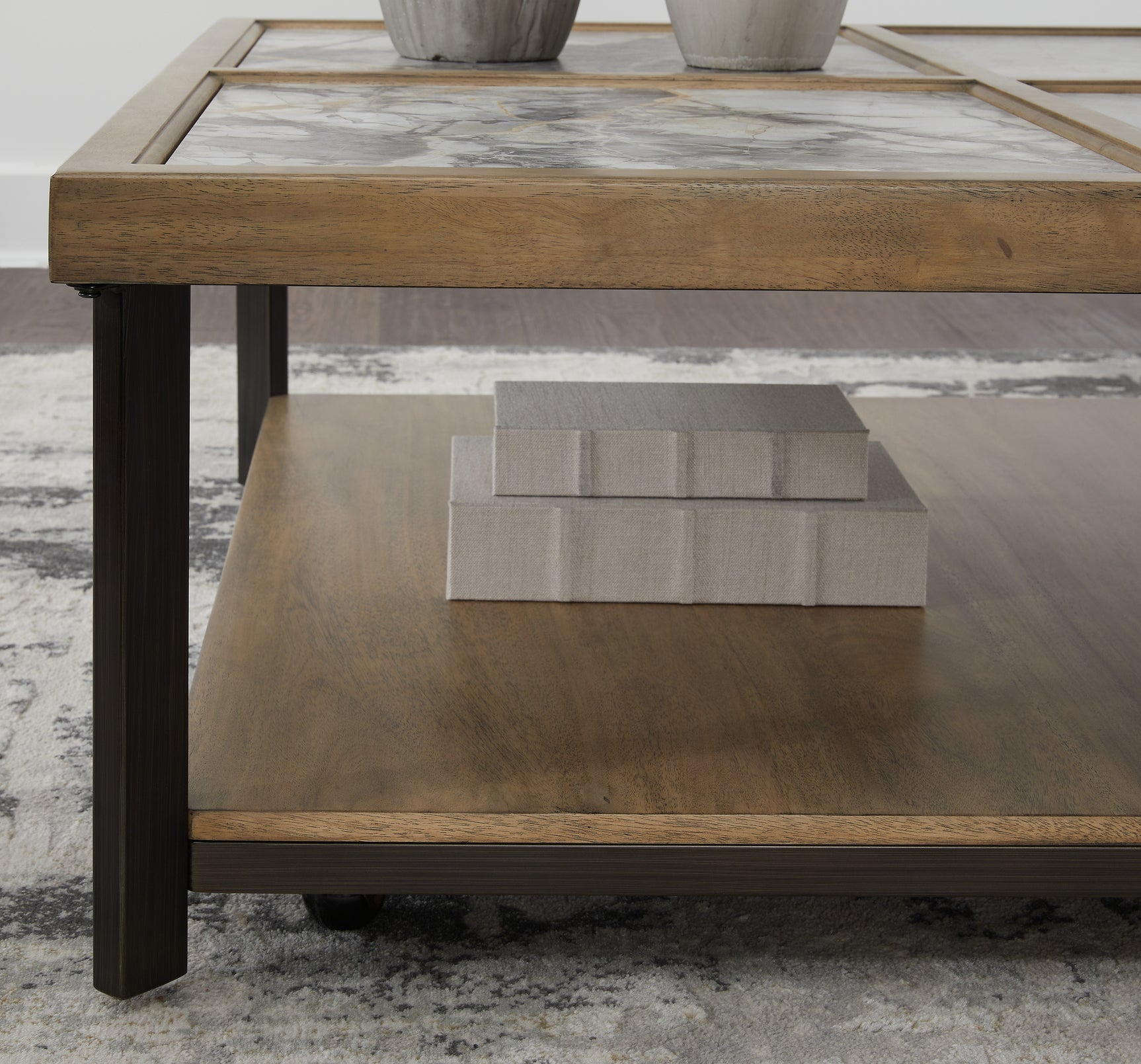 Montia Coffee Table frame detail showing light natural wood and black metal
