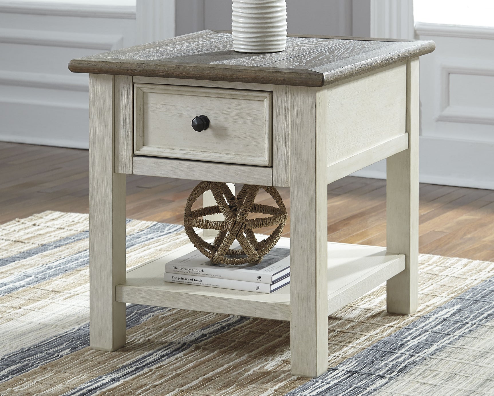 Opened drawer of Bolanburg two-tone end table showing smooth glide